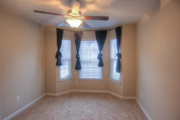 a view of a room with air conditioner duct and materials on floor