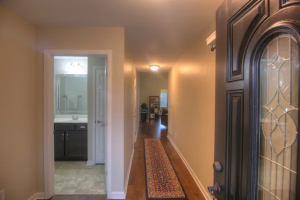 a view of a bathroom from a corridor