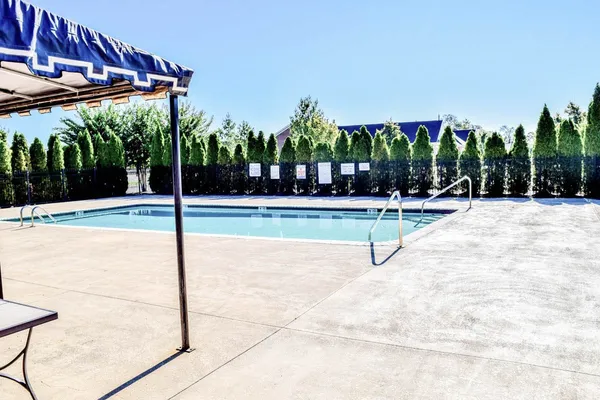 a view of a street with a building in the background