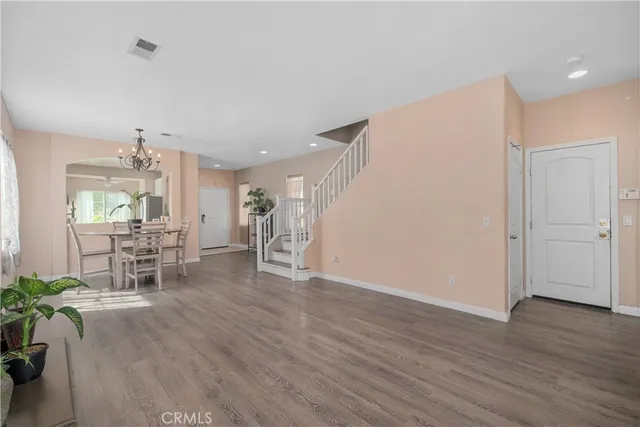 a view of a livingroom with furniture and a ceiling fan