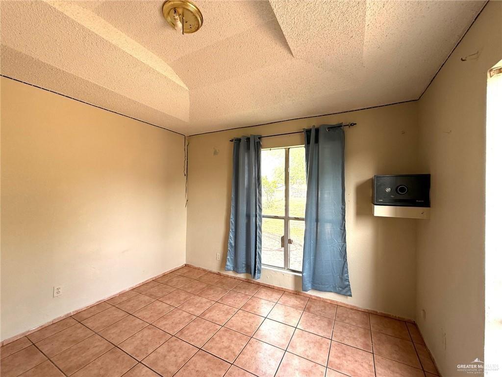 5501 North Moorefield Road Mission, TX 78574 - Photo 11 of 11 a view of a livingroom with wooden floor and a window