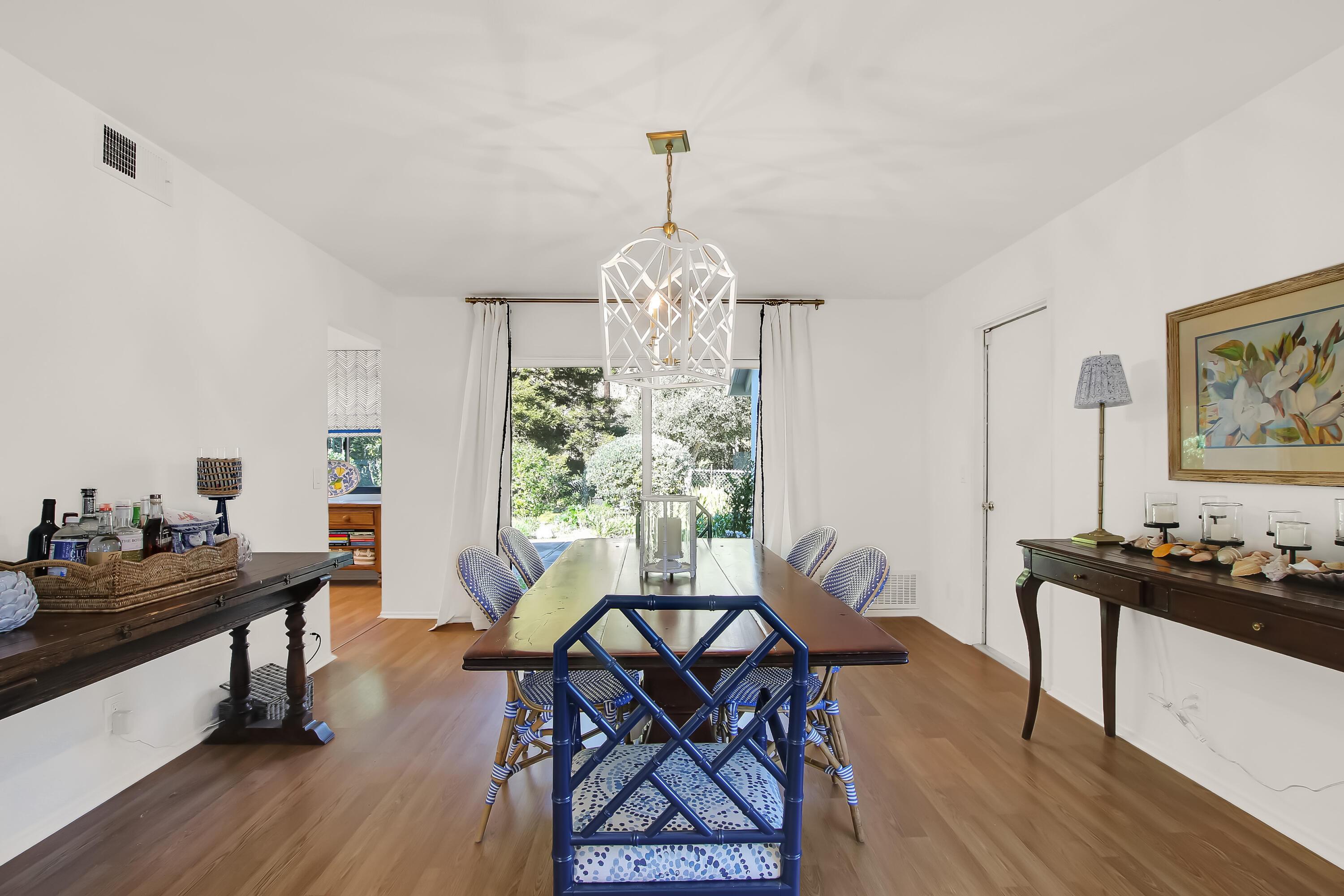 1102 Plaza Del Monte Santa Barbara, CA 93101 - Photo 20 of 53 a view of a dining room with furniture window and wooden floor