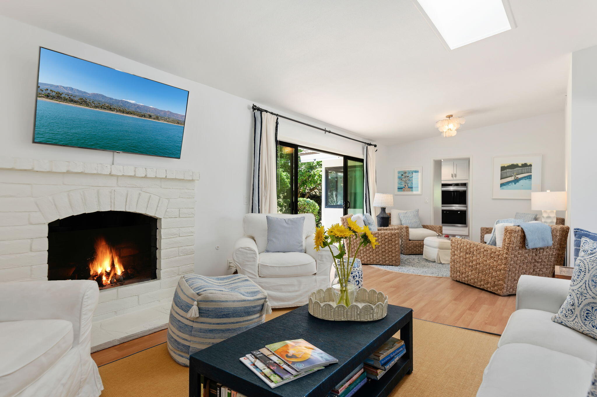 1102 Plaza Del Monte Santa Barbara, CA 93101 - Photo 4 of 53 a living room with furniture fireplace and flat screen tv