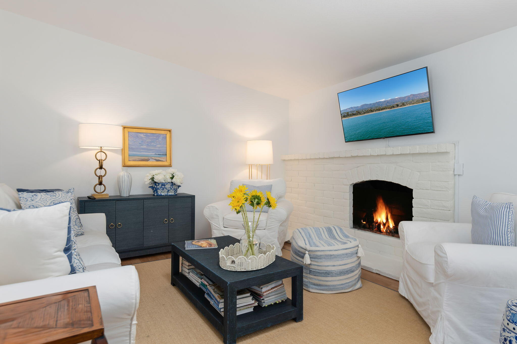 1102 Plaza Del Monte Santa Barbara, CA 93101 - Photo 7 of 53 a living room with furniture a fireplace and a flat screen tv