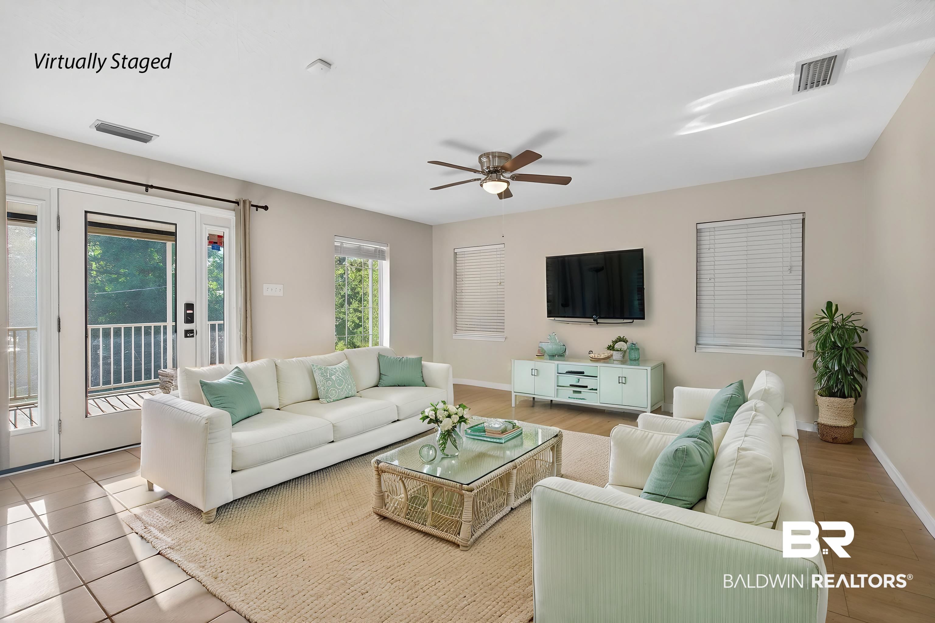 9624 North Bay Street Foley, AL 36535 - Photo 18 of 59 Spacious living area featuring light-toned walls, tile flooring, a ceiling fan, and access to an outdoor balcony