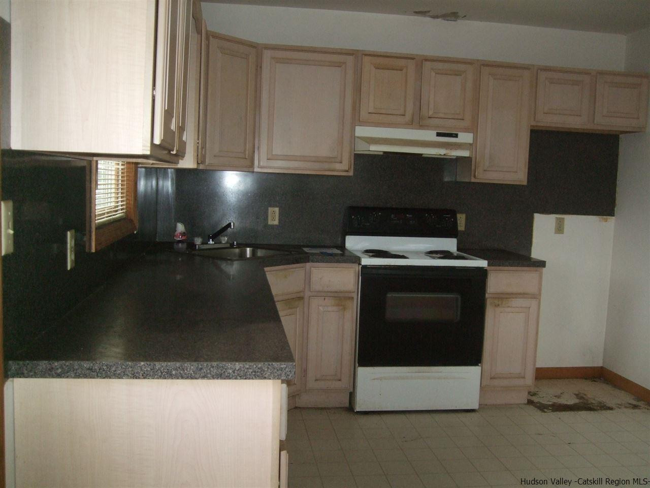 63 Hommelville Road Saugerties, NY 12477 - Photo 8 of 9 a kitchen with granite countertop a sink and a stove