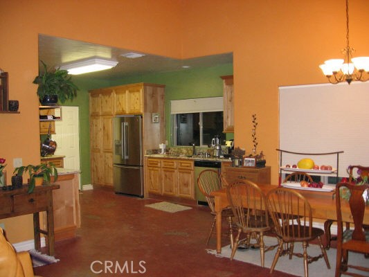 12241 Broadway Road Moorpark, CA 93021 - Photo 2 of 10 a view of a dining room with furniture and a kitchen