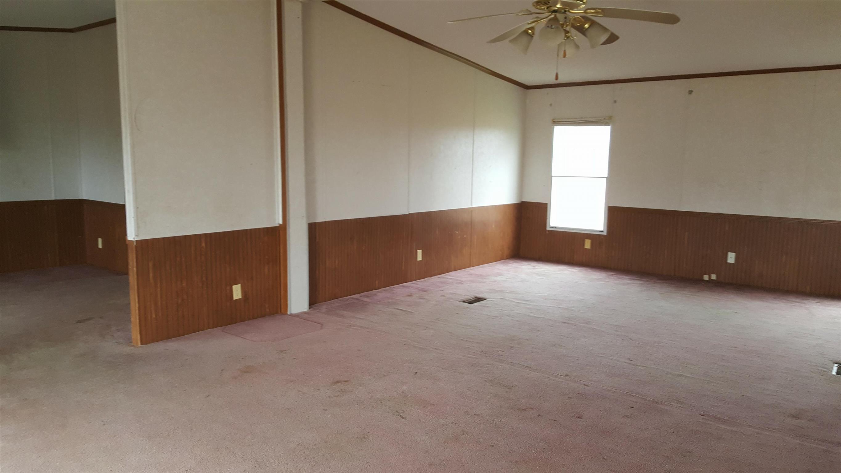 10 Zinker Road Lawrenceburg, TN 38464 - Photo 2 of 11 a view of an empty room with a window