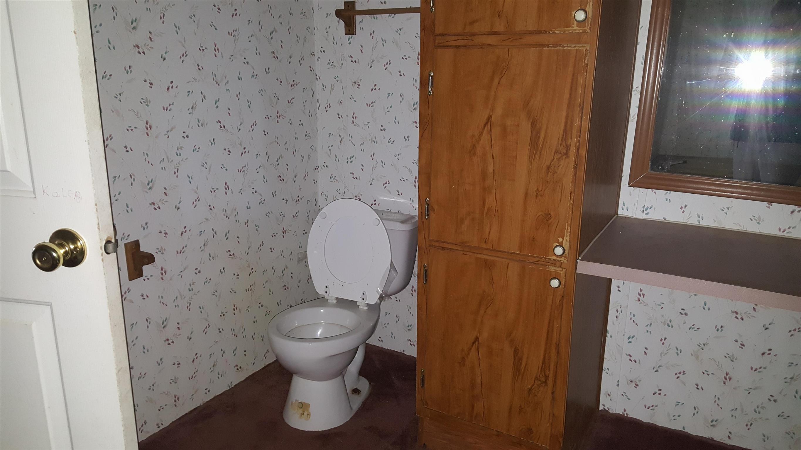 10 Zinker Road Lawrenceburg, TN 38464 - Photo 11 of 11 a bathroom with a toilet and a shower