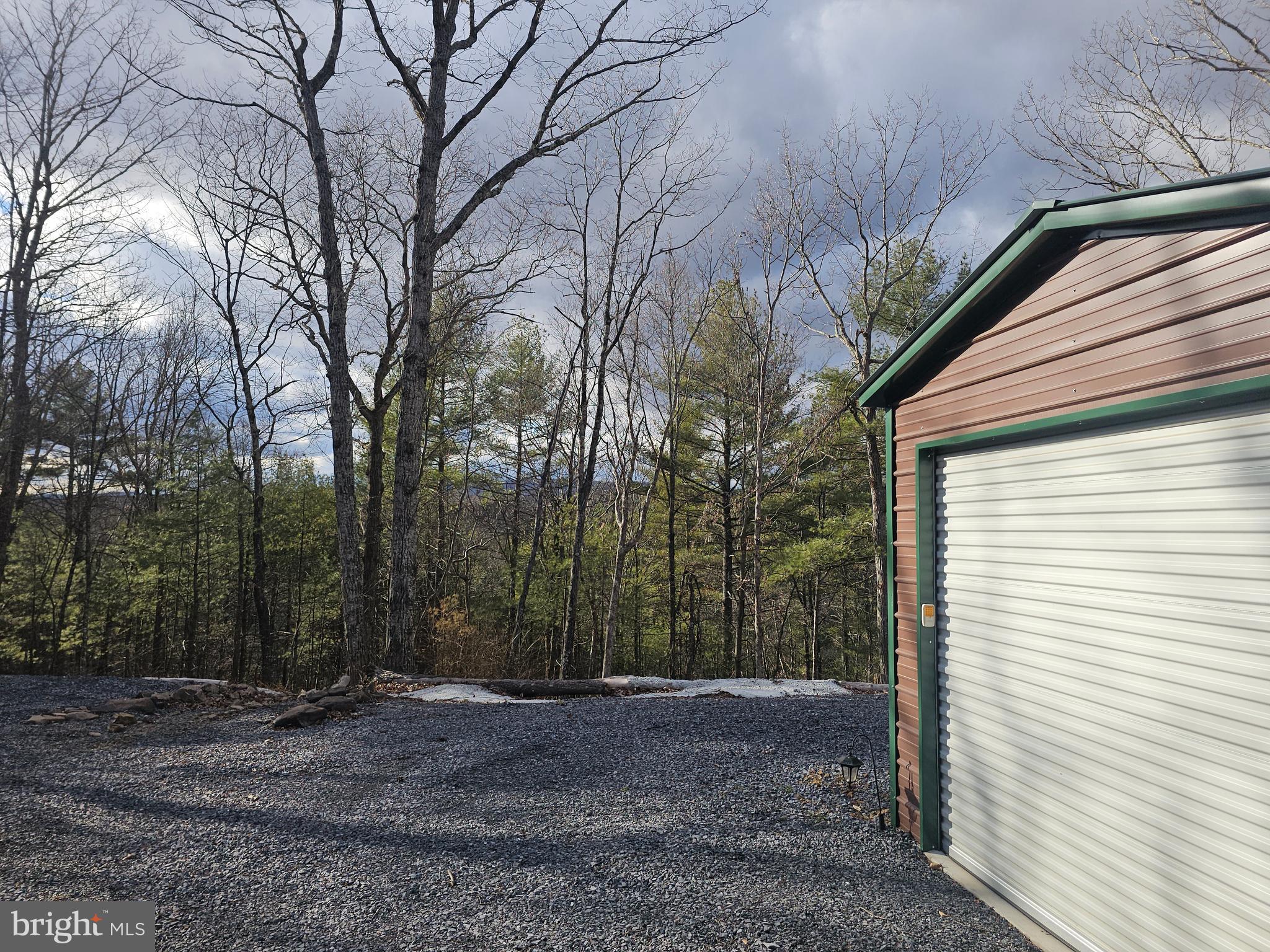 211 Martin Road Artemas, PA 17211 - Photo 35 of 38 a backyard of a house with trees