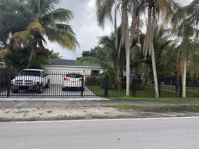 a view of street from a house next to a yard