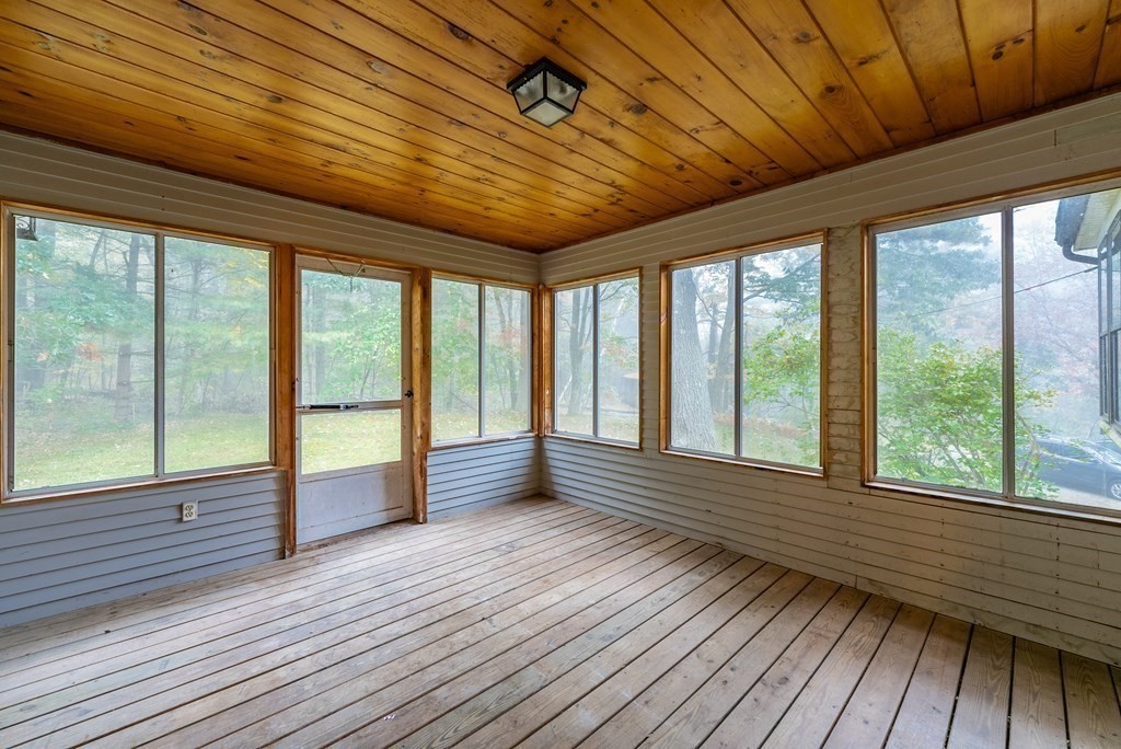 22 Upper Pomeroy Road Montgomery, MA 01085 - Photo 18 of 23 a view of an empty room with wooden floor and a floor to ceiling window