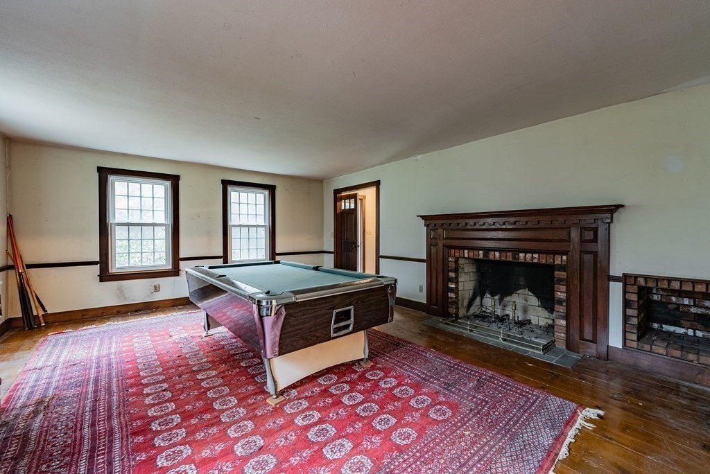 22 Upper Pomeroy Road Montgomery, MA 01085 - Photo 8 of 23 a living room with furniture rug and a fireplace