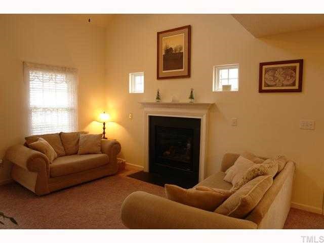 5413 Golden Moss Trail Raleigh, NC 27613 - Photo 2 of 12 a living room with furniture and a fireplace