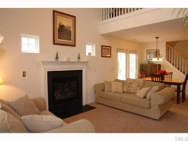 5413 Golden Moss Trail Raleigh, NC 27613 - Photo 3 of 12 a living room with furniture and a fireplace