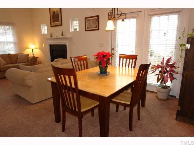 5413 Golden Moss Trail Raleigh, NC 27613 - Photo 6 of 12 a view of a dining room with furniture window and wooden floor