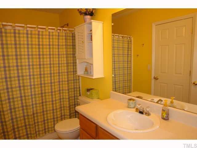 5413 Golden Moss Trail Raleigh, NC 27613 - Photo 10 of 12 a bathroom with a sink toilet and shower