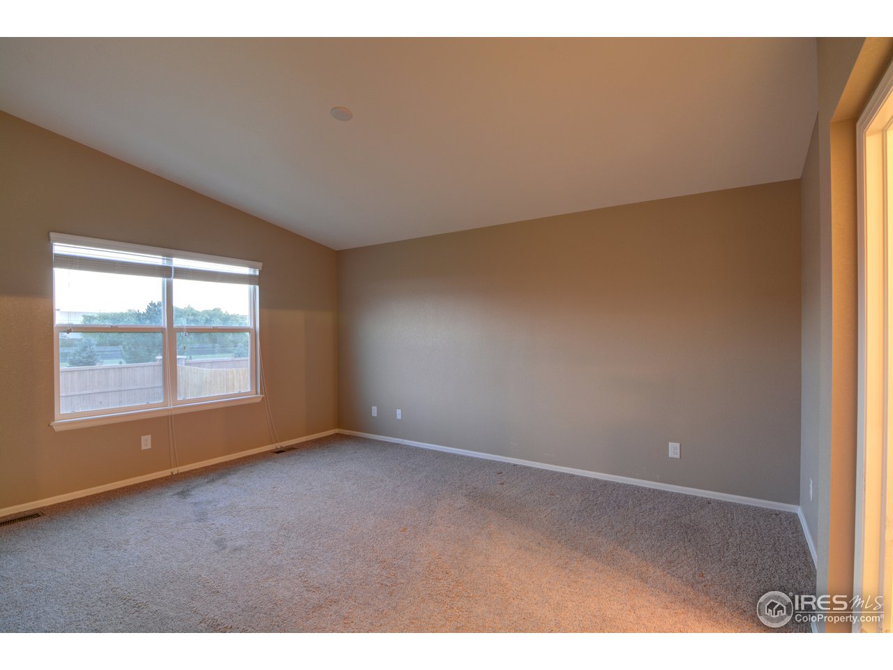 8050 Raspberry Drive Frederick, CO 80504 - Photo 11 of 17 a view of an empty room with a window