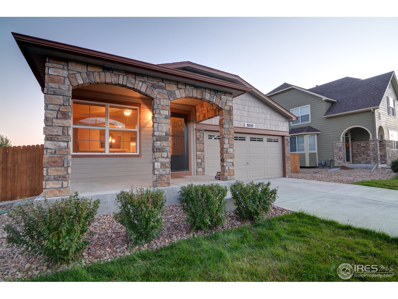 8050 Raspberry Drive Frederick, CO 80504 - Photo 17 of 17 a front view of a house with garden