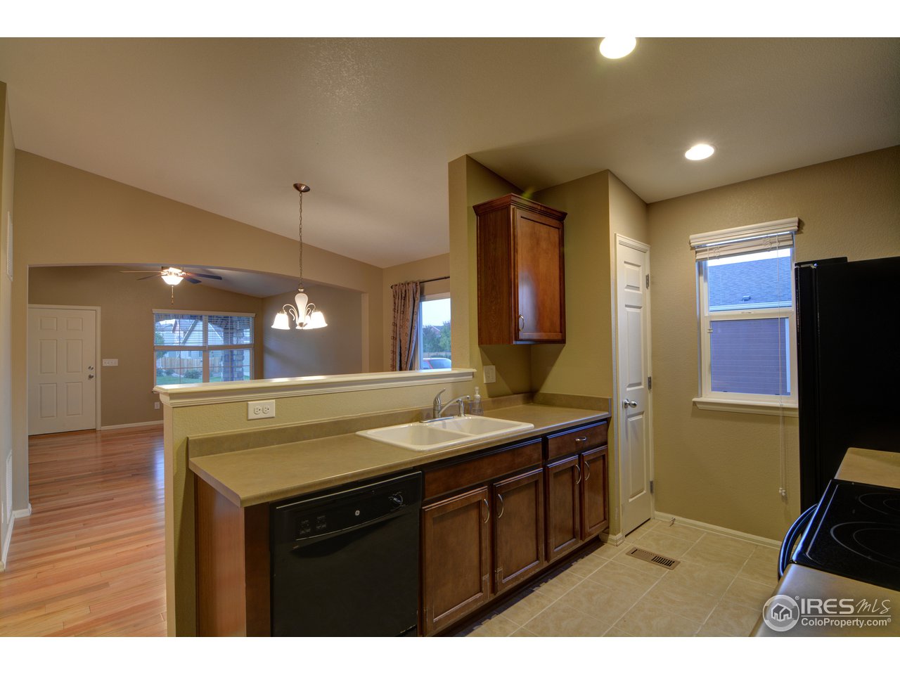 8050 Raspberry Drive Frederick, CO 80504 - Photo 4 of 17 a bathroom with a sink a vanity and a mirror