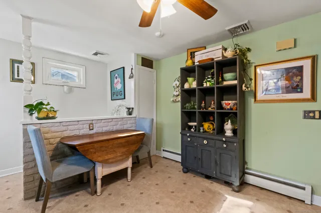 a view of a workspace with furniture