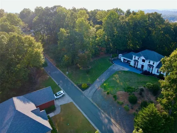 an aerial view of a house with a garden