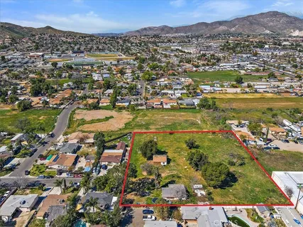 an aerial view of residential building and lake