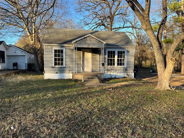a bathroom with a sink a toilet and a window