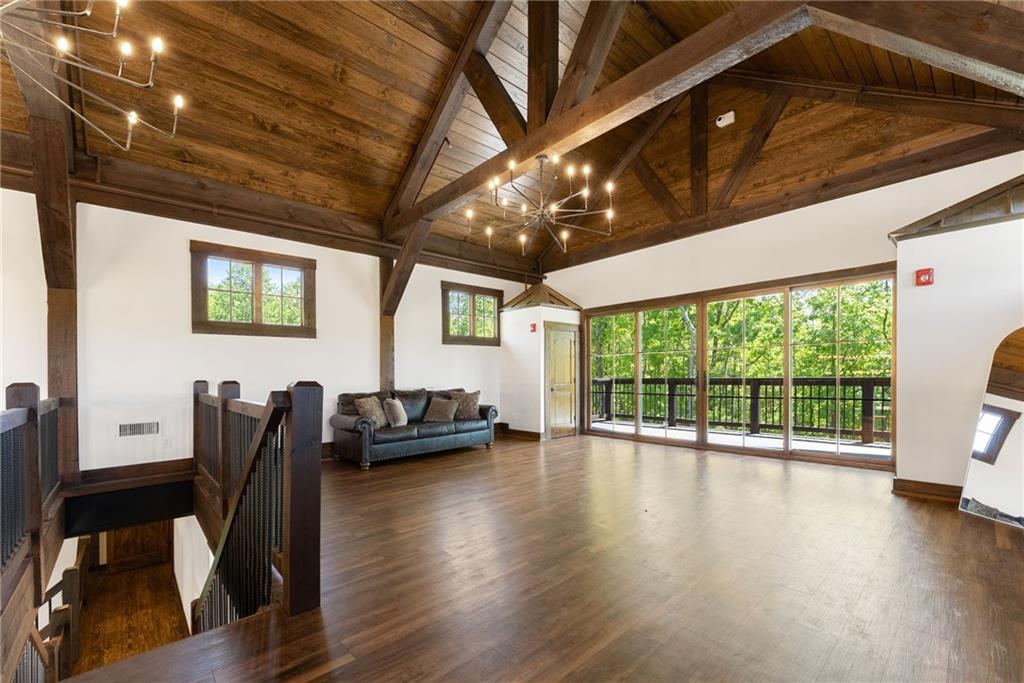 3263 Tanners Mill Road Gainesville, GA 30507 - Photo 140 of 197 a view of a livingroom with furniture window and wooden floor