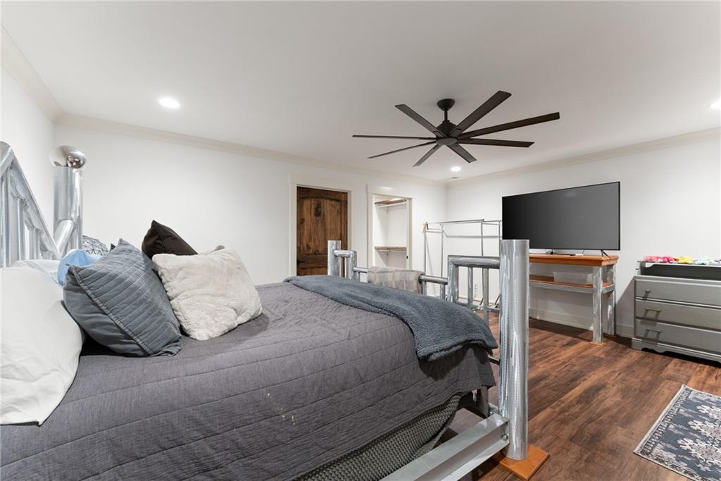 3263 Tanners Mill Road Gainesville, GA 30507 - Photo 165 of 197 a bedroom with a bed and a flat screen tv