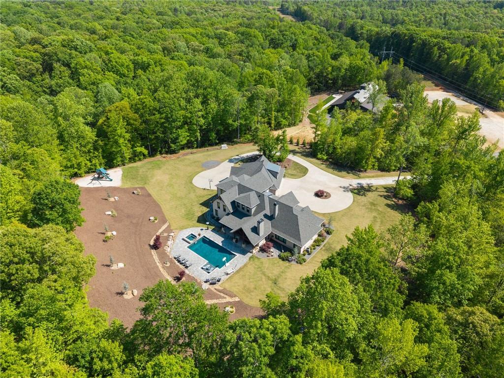 3263 Tanners Mill Road Gainesville, GA 30507 - Photo 182 of 197 an aerial view of residential house with outdoor space and trees all around