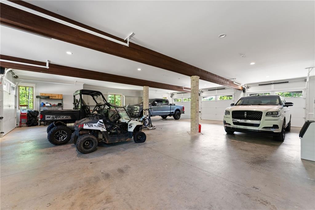 3263 Tanners Mill Road Gainesville, GA 30507 - Photo 32 of 197 a view of parking garage with cars parked
