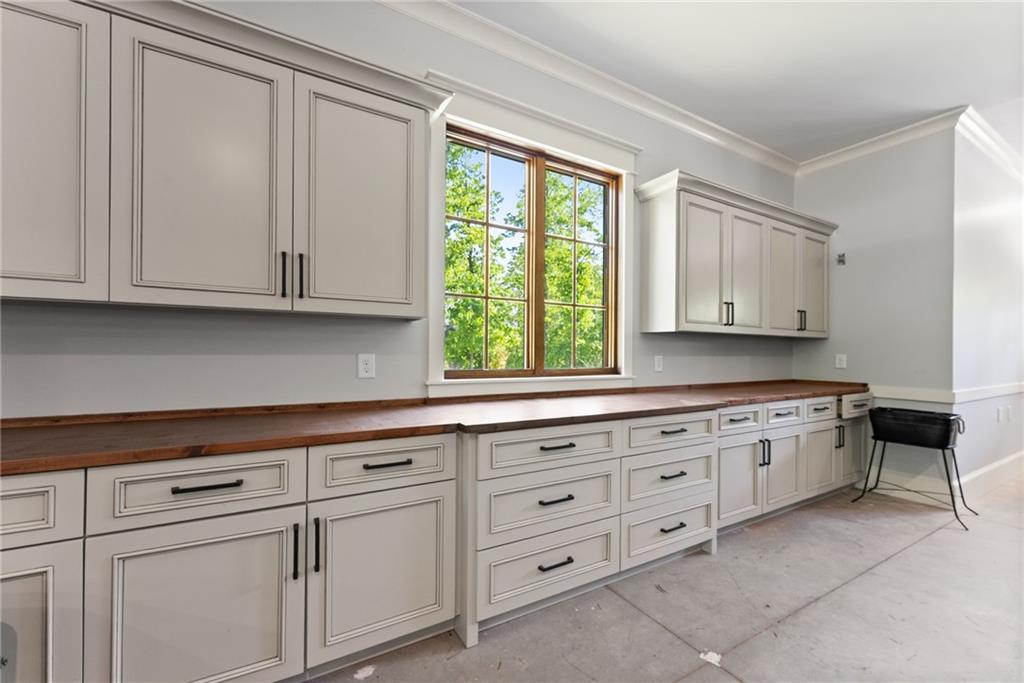 3263 Tanners Mill Road Gainesville, GA 30507 - Photo 33 of 197 a kitchen with granite countertop white cabinets and window