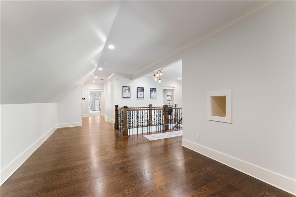 3263 Tanners Mill Road Gainesville, GA 30507 - Photo 47 of 197 a view of an empty room with wooden floor and windows