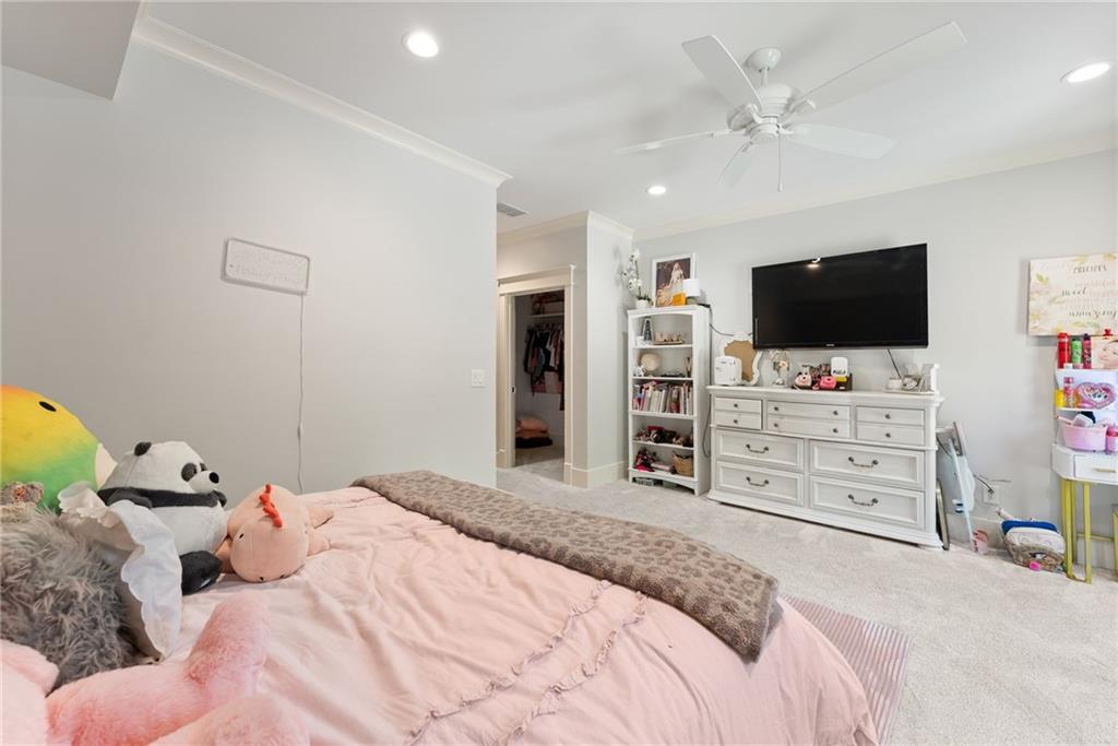 3263 Tanners Mill Road Gainesville, GA 30507 - Photo 52 of 197 a bedroom with a bed and a flat screen tv