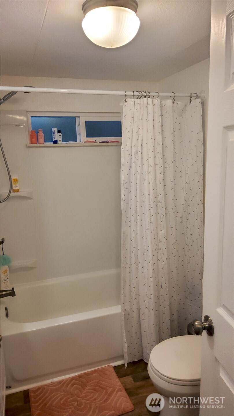 13320 Highway 99, Unit 34 Everett, WA 98204 - Photo 11 of 23 a bathroom with a sink and a toilet