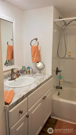 a bathroom with a sink and mirror