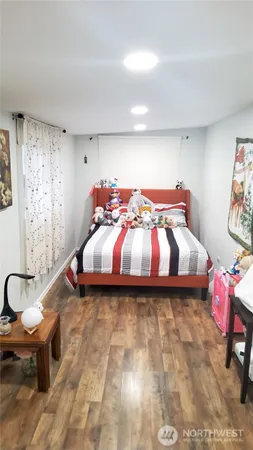 a bedroom with a bed and a chair