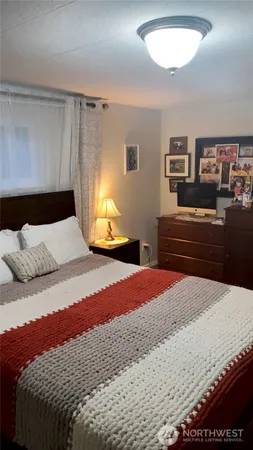 a bedroom with a bed and dresser