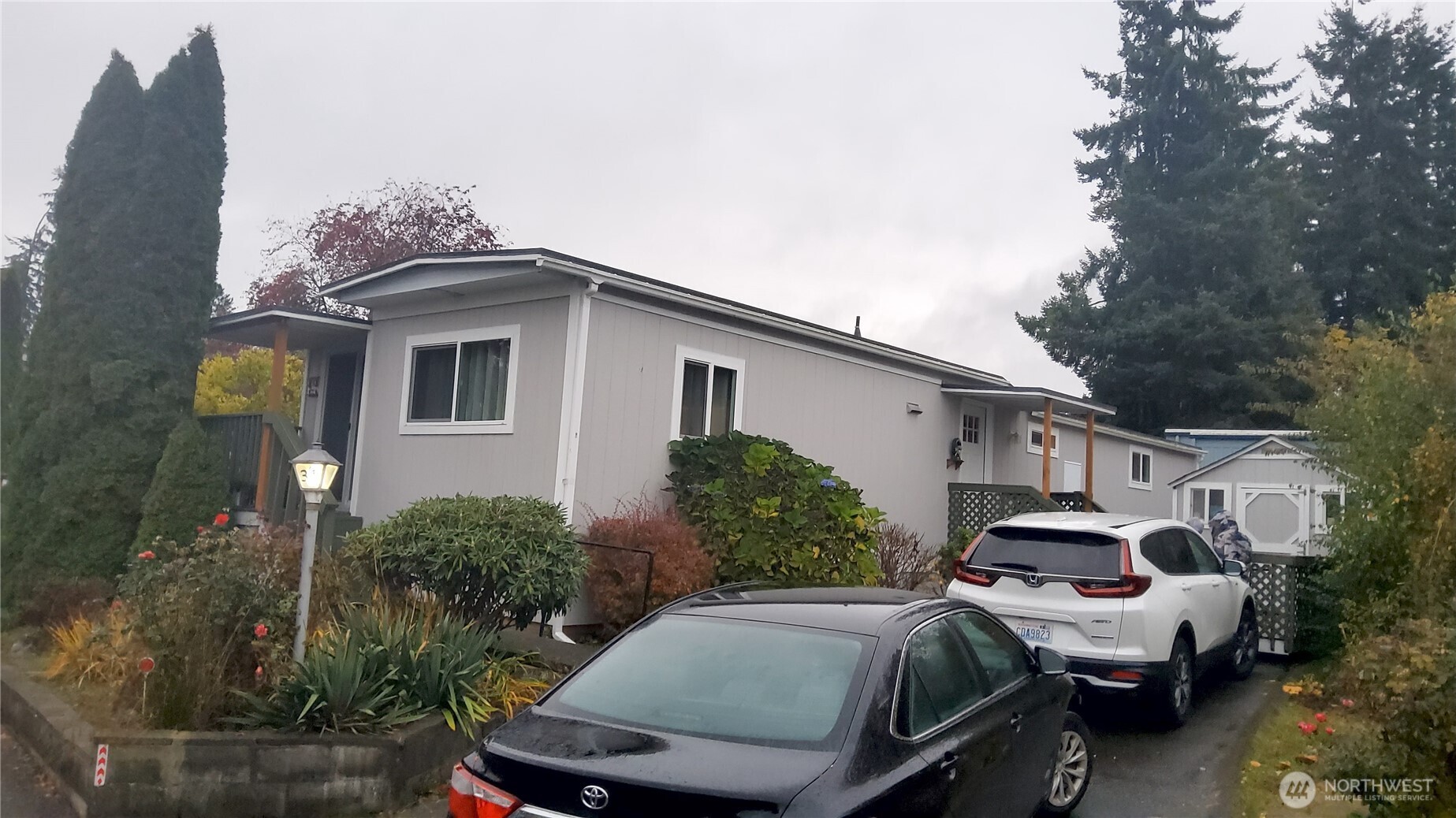 13320 Highway 99, Unit 34 Everett, WA 98204 - Photo 23 of 23 a car parked in front of a house