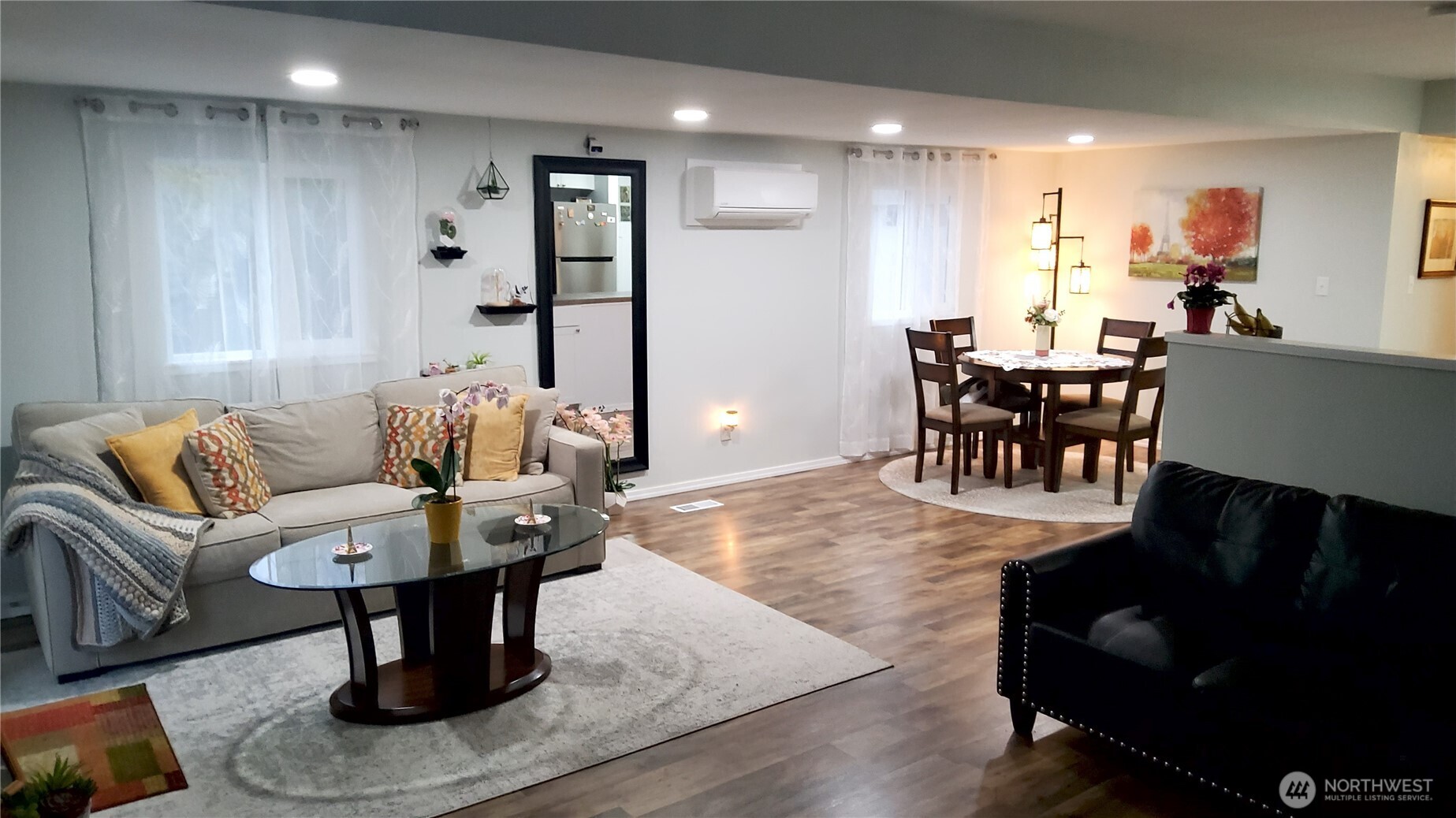 13320 Highway 99, Unit 34 Everett, WA 98204 - Photo 5 of 23 a living room with furniture a table and kitchen view