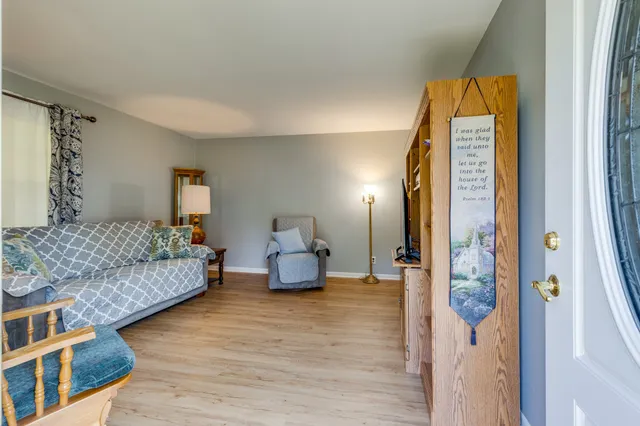 a spacious bedroom with a bed and a couch