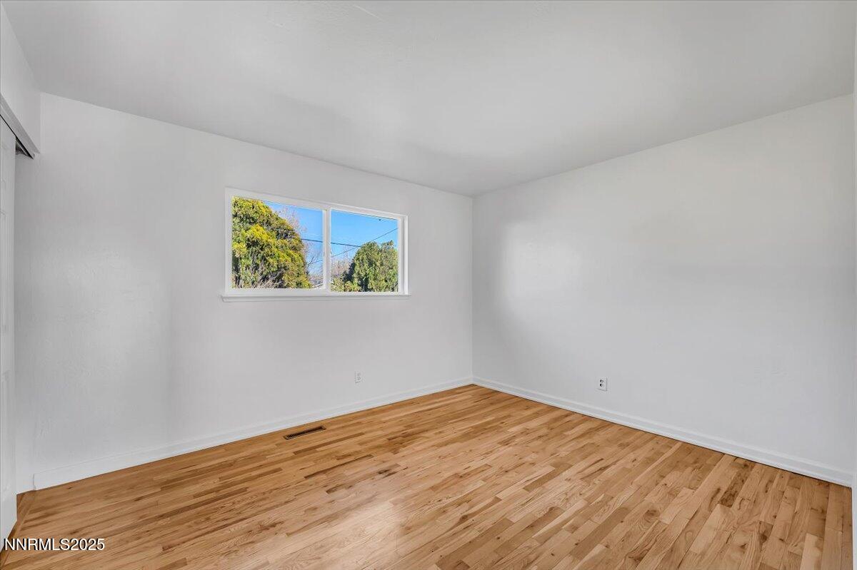 2801 Kings Row Reno, NV 89503 - Photo 18 of 32 a view of empty room with wooden floor