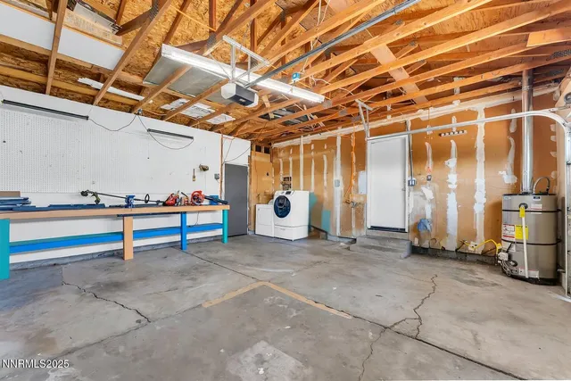 a view of an empty room with wooden walls