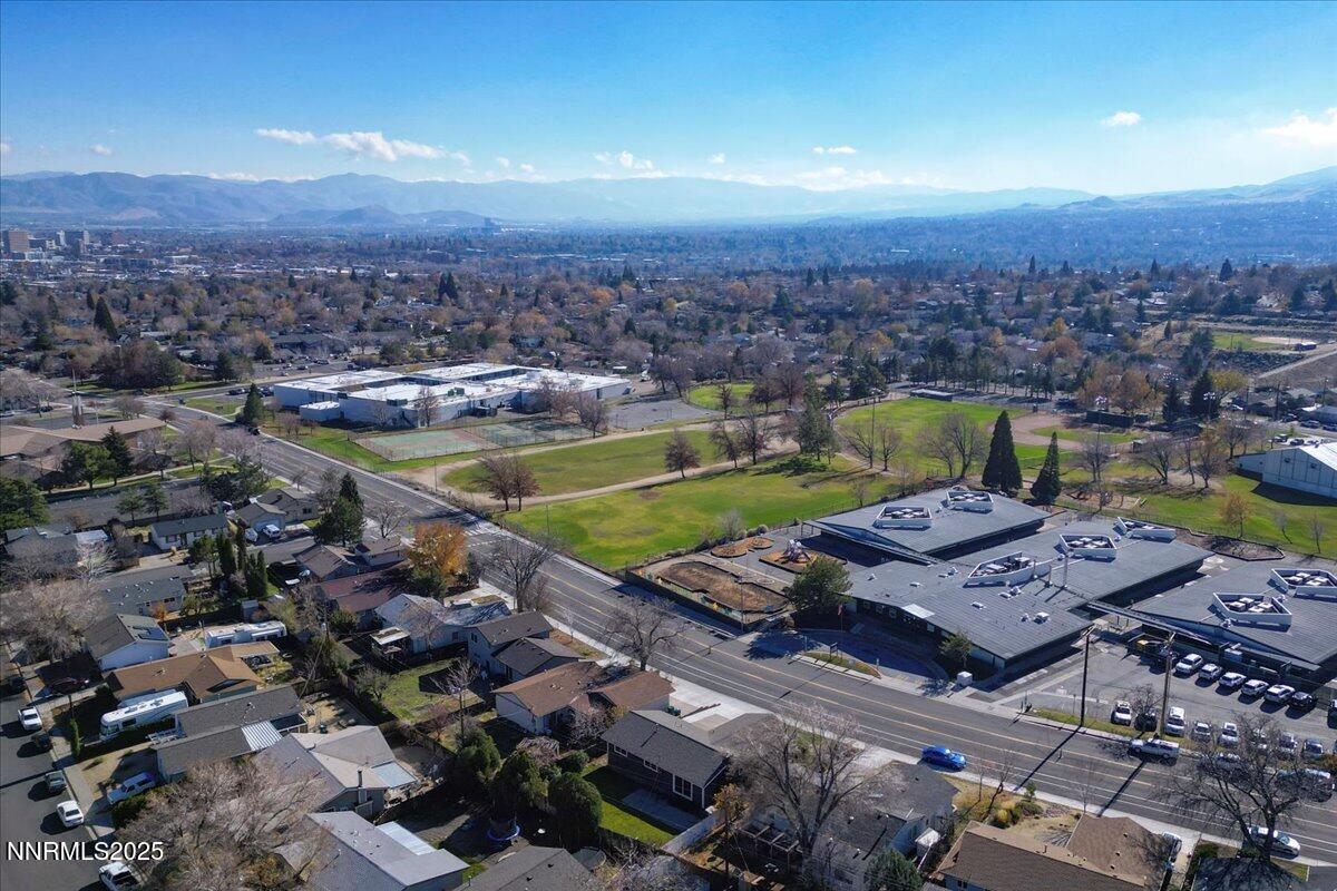 2801 Kings Row Reno, NV 89503 - Photo 31 of 32 an aerial view of a house with a swimming pool outdoor seating and yard