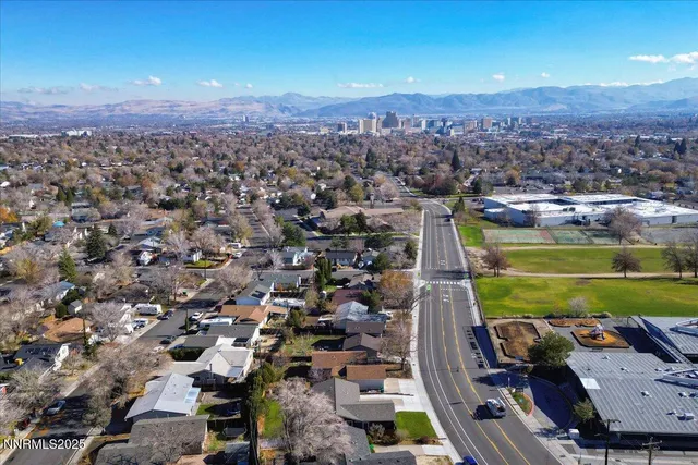 an aerial view of a city with lawn chairs
