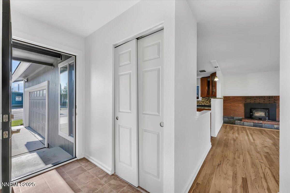 2801 Kings Row Reno, NV 89503 - Photo 4 of 32 a view of a hallway with wooden floor and a living room
