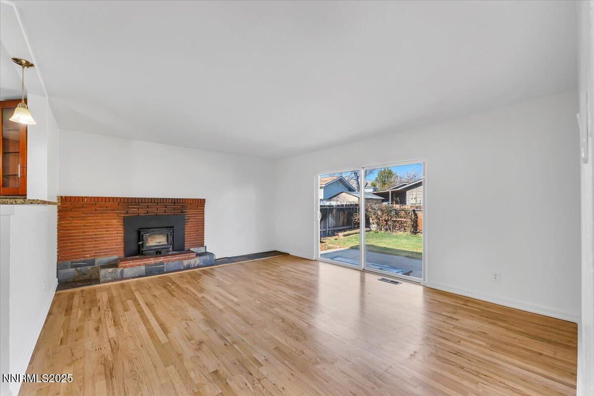 2801 Kings Row Reno, NV 89503 - Photo 5 of 32 a view of an empty room with window and wooden floor