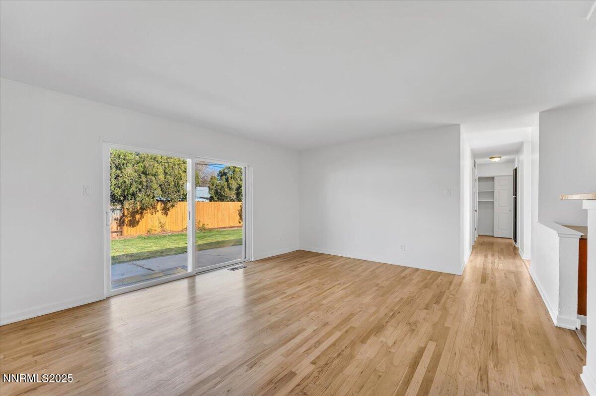 2801 Kings Row Reno, NV 89503 - Photo 6 of 32 wooden floor in an empty room with a window