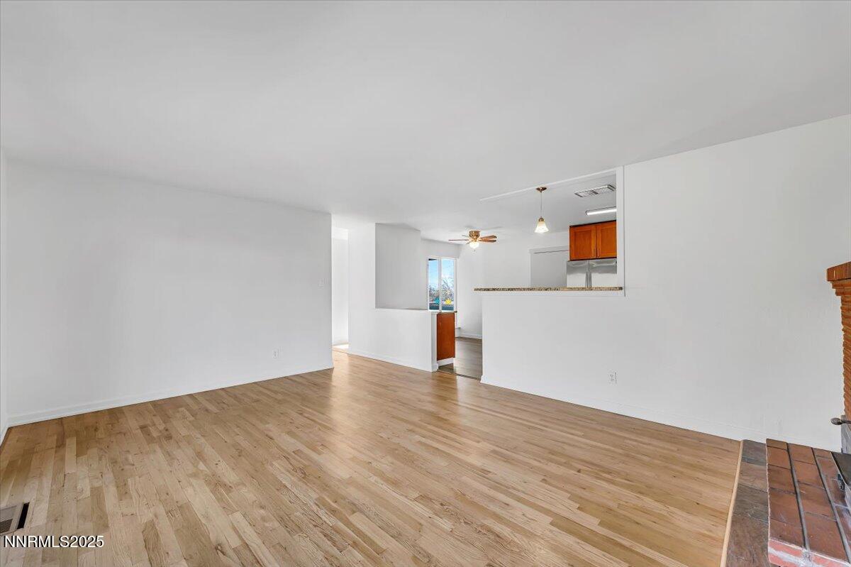 2801 Kings Row Reno, NV 89503 - Photo 7 of 32 a view of empty room with wooden floor